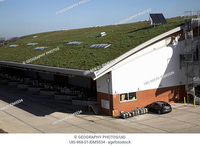 Sedum grass roofing and landscaped surroundings to blend in Adnams brewery distribution center in a rural location at Reydon, near Southwold, Suffolk, England