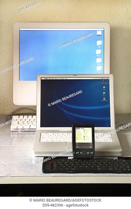 IMac G5 computer, IBook G4 laptop, Palm IIIc PDA