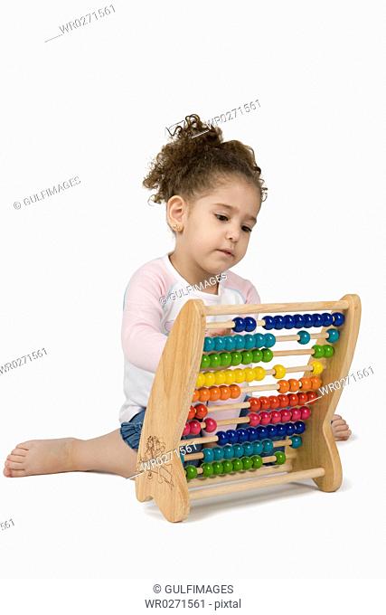 Girl playing with abacus