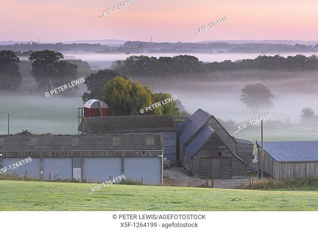 Misty Dawn over Farm Buildings nr Southwick Hampshire