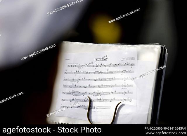 08 August 2022, Schleswig-Holstein, Kiel: A sheet of music of the song ""In the Navy"" is attached to a music stand in front of the ""Gorch Fock""