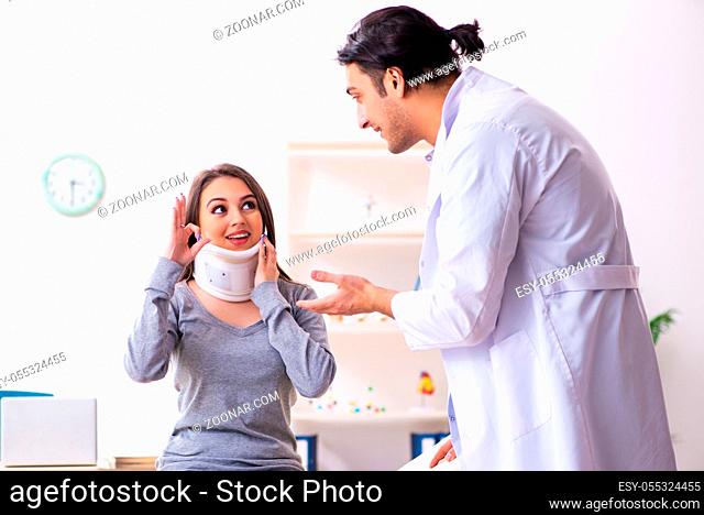 The young male doctor and female beautiful patient