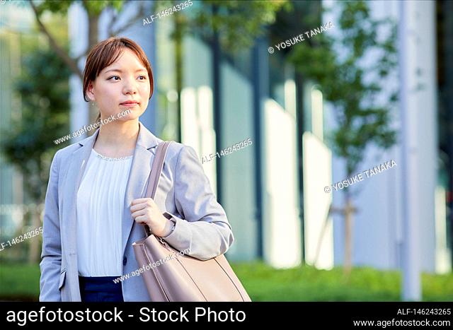 Young Japanese businesswoman outside