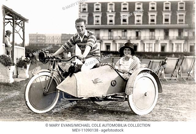 Young man and young lady on a 1920 New Gerrard motorcycle & sidecar combination at the seaside circa 1920