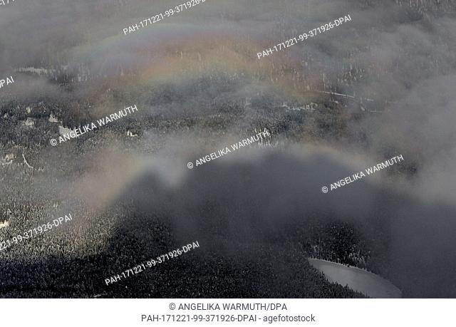 A rainbow can be seen above the shadow of Zugspitze mountain in Garmisch-partenkirchen, Germany, 21 December 2017. Photo: Angelika Warmuth/dpa