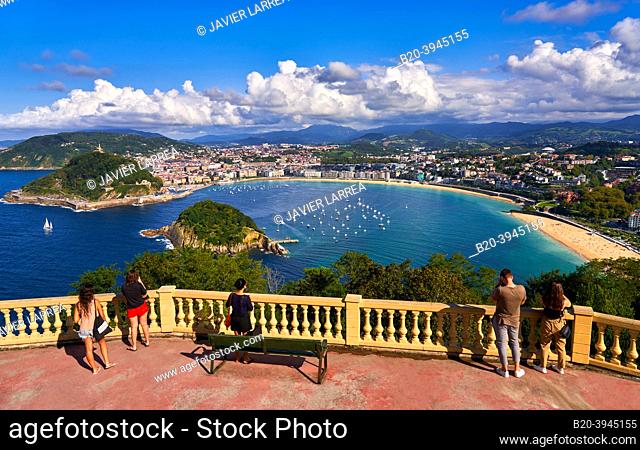 Tourists photographing La Concha Bay from the Monte Igeldo viewpoint, Donostia, San Sebastian, cosmopolitan city of 187, 000 inhabitants