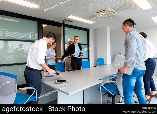 startup business, young creative people group entering meeting room, modern office interior and motion blur