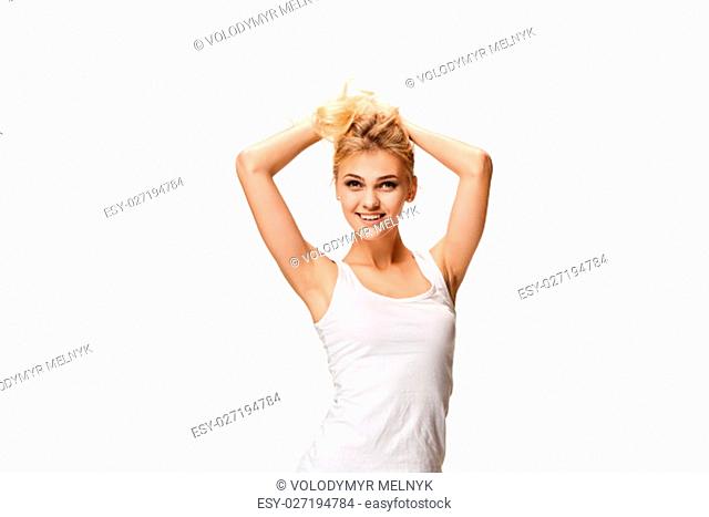 The young woman's portrait with happy emotions on white studio background