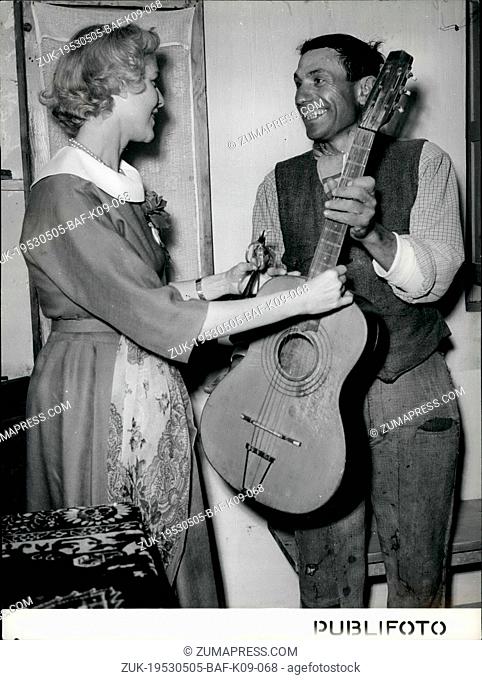 May 05, 1953 - 1/9 at land reform area near Potenze, villager brings out his guitar to play tune for ambassador. (Credit Image: © Keystone Press Agency/Keystone...