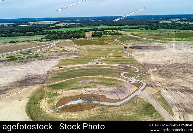 04 June 2020, Brandenburg, Welzow: From Gut Geisendorf a path leads to the recultivated Geisendorf mountain at the Welzow-Süd open-cast lignite mine of LEAG...