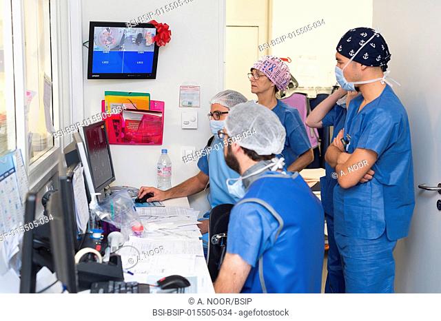 Reportage in the interventional scanner service in Pasteur 2 Hospital, Nice, France. Vertebroplasty- cementoplasty operation to treat a vertebral facture