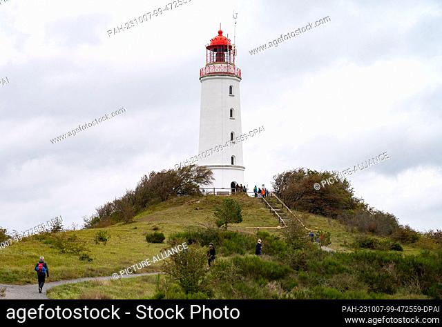 06 October 2023, Mecklenburg-Western Pomerania, Kloster: The lighthouse Dornbusch on the island of Hiddensee. The lighthouse is Hiddensee's landmark and a...