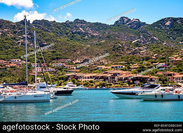 Porto Cervo, Sardinia / Italy - 2019/07/20: Panoramic view of luxury yacht port, marina and residences of Porto Cervo resort at the Costa Smeralda coast of...