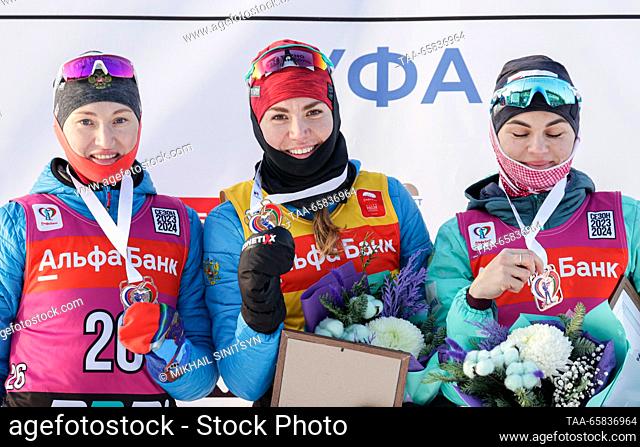 RUSSIA, UFA - DECEMBER 17, 2023: Silver medalist Anastasia Yegorova, gold medalist Viktoria Slivko, and bronze medalist Natalya Gerbulova (L-R) of Russia pose...