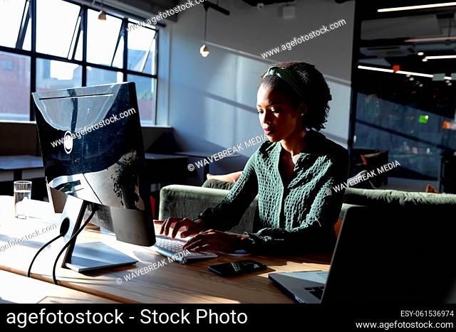 African american young businesswoman using computer in office