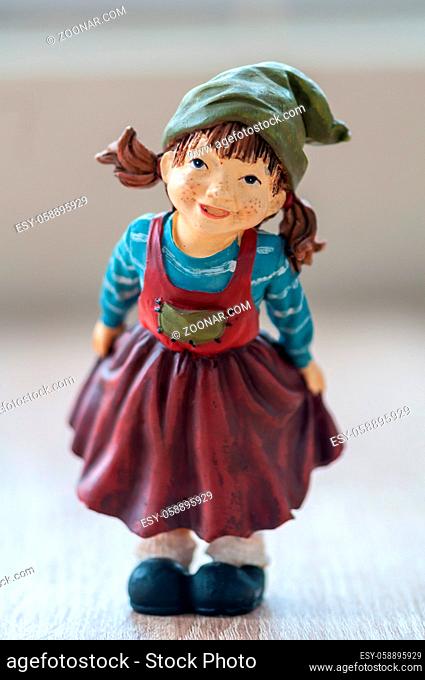 Close-up of a garden gnome on a wooden table