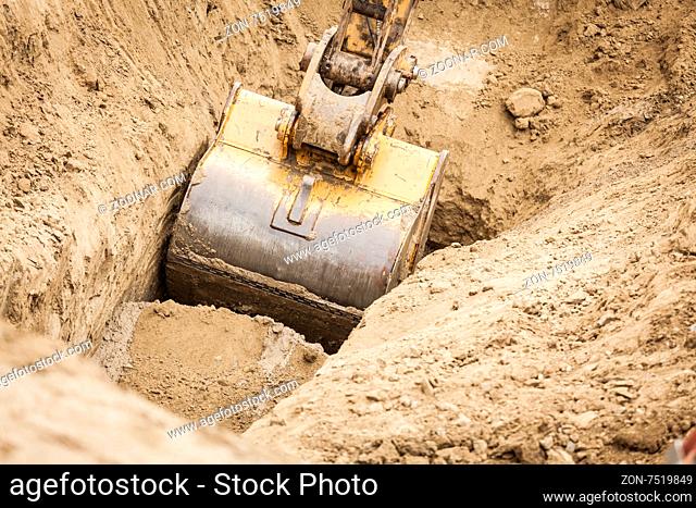 Working Excavator Tractor Digging A Trench