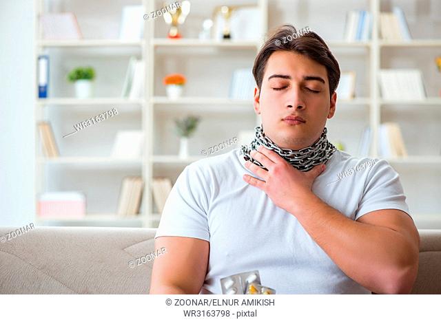 Young man suffering from sore throat