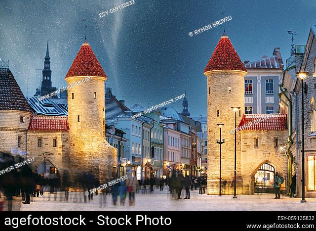 Tallinn, Estonia. Night Starry Sky Above Famous Landmark Viru Gate Gates. Street Lighting In Winter Holiday Evening. Christmas Xmas