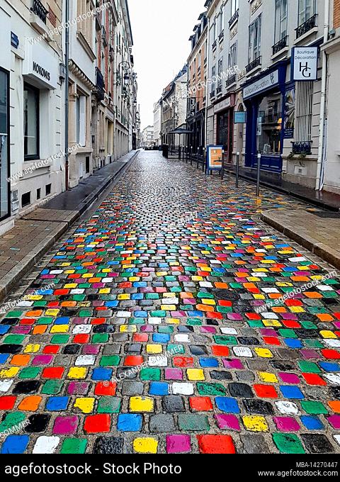 Colored cobbles in rue de Tambour, Reims, France