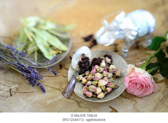 Dried lime blossoms, lavender, dried hibiscus blossoms, and rose buds