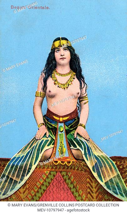 Oriental Egyptian Beauty wearing a 'Dragonfly Wing' skirt, a very popular motif of the period in fashion and jewellery. The terminology was Plique-a-jour...