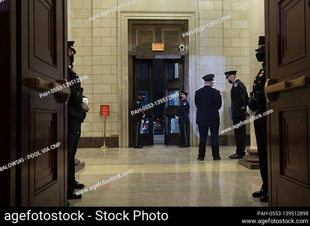 Riot damage can be seen as Capitol Police officers prepare for the arrive of the remains of Capitol Police officer Brian Sicknick to lay in honor in the Rotunda...