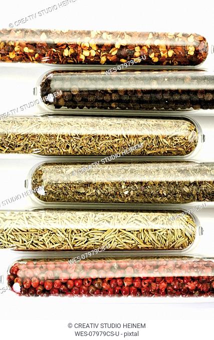 Variety of dried spices in glasses, close-up, elevated view