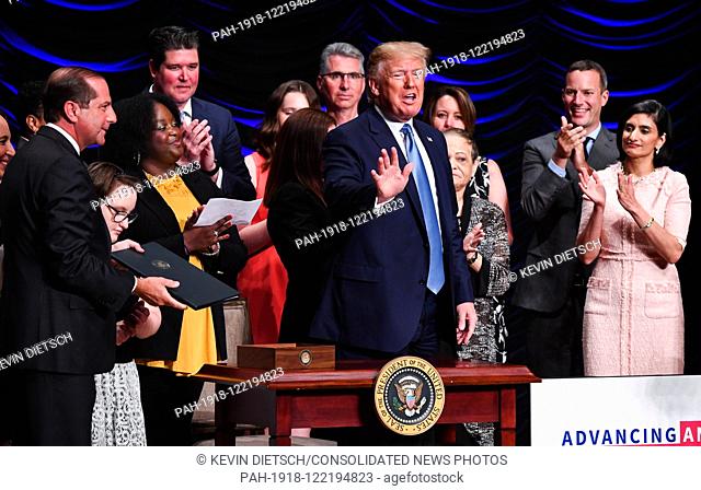 President Donald Trump waves after singing an executive order to overhaul the nation's organ transplants and kidney dialysis systems at the Ronald Reagan...