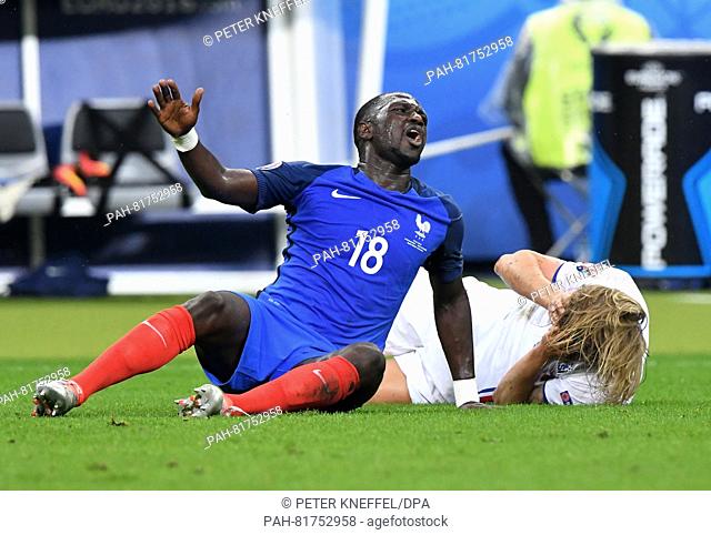 France's Moussa Sissoko and Iceland's Birkir Bjarnason during the UEFA EURO 2016 quarter final soccer match between France and Iceland at the Stade de France in...