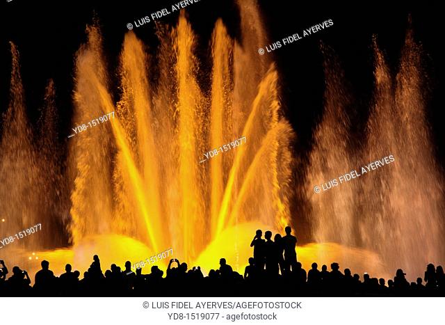 Tourists enjoying the light show of the Plaza de Espana in Barcelona, Catalonia, Spain