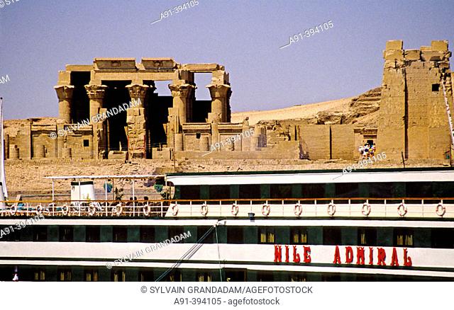 Cruise boats moored by the temple of Kom Ombo on river Nile bank. Egypt