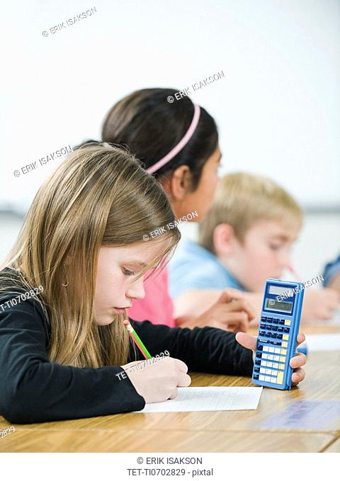 Students doing math work in classroom