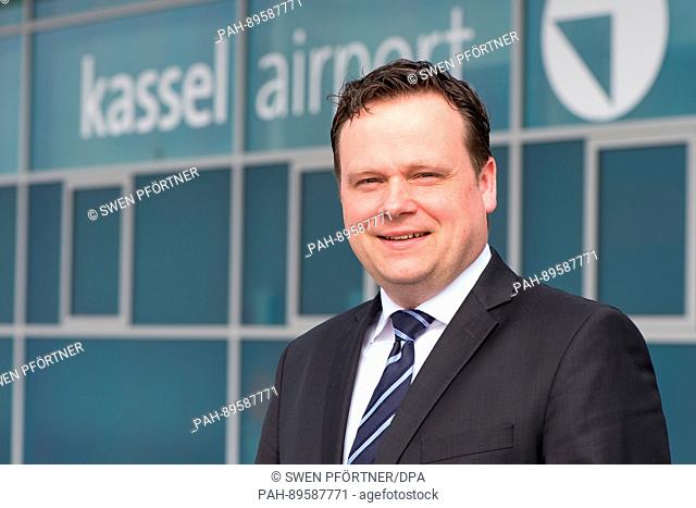 The new managing director of Kassel Aiport, Lars Ernst, smiles during his introduction in front of a terminal of Kassel Airport in Calden, Germany, 4 April 2017