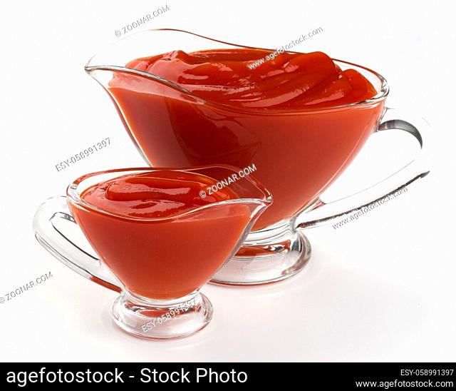 Glass bowls of ketchup isolated on white background with clipping path