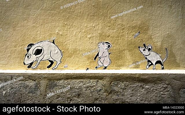 Graffiti in the old town of Montpellier. If the cat is out of the house, the mice dance on the table