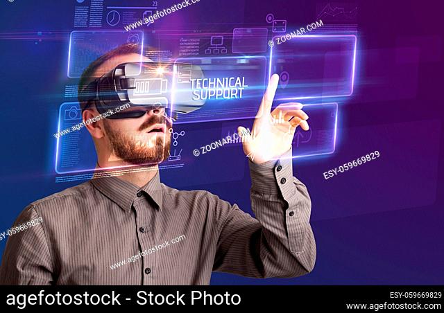 Businessman looking through Virtual Reality glasses with TECHNICAL SUPPORT inscription, new technology concept