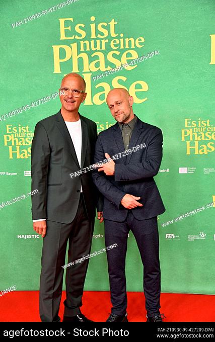 28 September 2021, North Rhine-Westphalia, Cologne: Actors Christoph Maria Herbst and Jürgen Vogel , l-r, come to the film premiere of the bestseller adaptation...