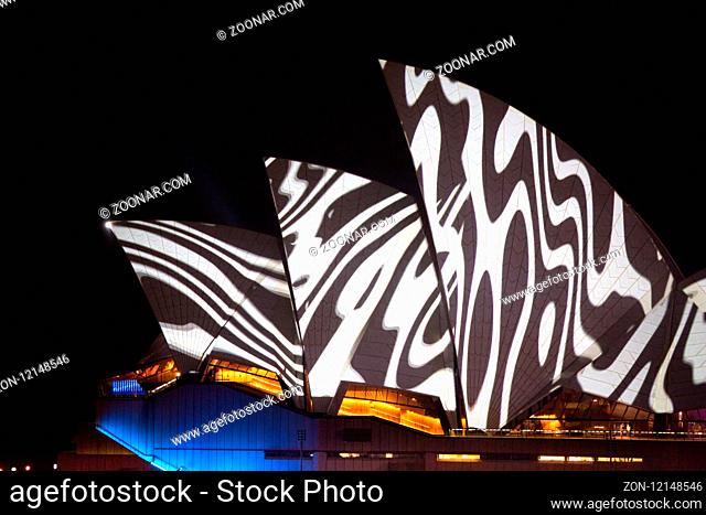 Sydney, Australia - May 25, 2018; Sydney Opera House lit with vibrant colours geomeric patterns and motion graphics during the Annual Vivid Sydney celebrations