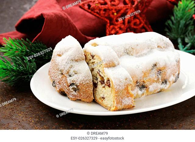 traditional Christmas stollen cake with raisins and powdered sugar