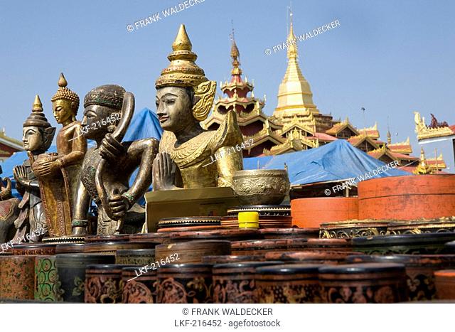 Wooden, religous buddistic statues on a market at Inle Lake, Shan State, Myanmar