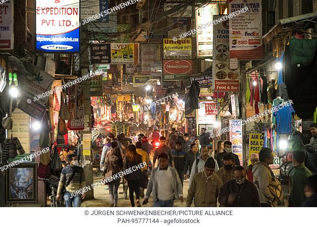 In the evenings, the inhabitants and tourists travel through the streets of Thamel, the popular tourist district of Kathmandu