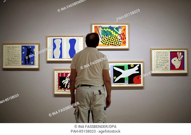 A visitor looks at graphic works by Henri Matisse during a preview of the exhibition 'Die Hand zum Singen bringen' (Bring the hand to sing' in the Pablo Picasso...