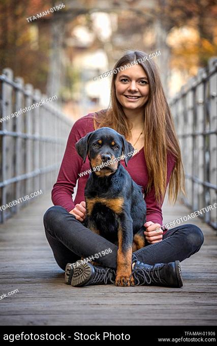 woman with Rottweiler Puppy