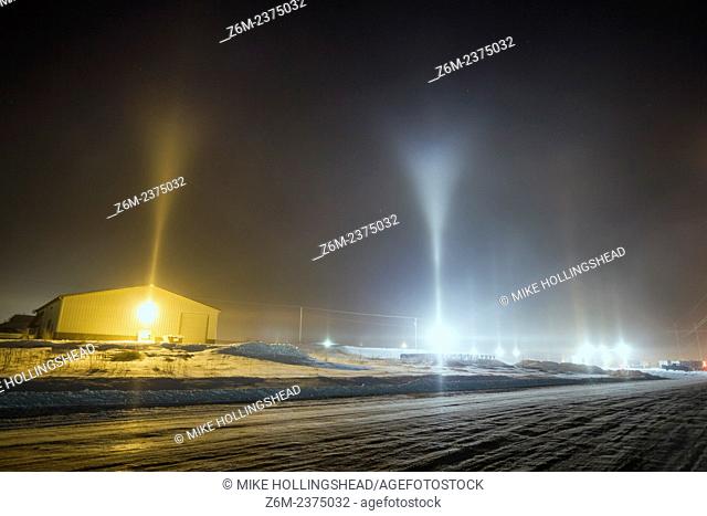 Y-shape light pillars form in Blair Nebraska in freezing temps and from conditions related to steam production from a corn milliing plant