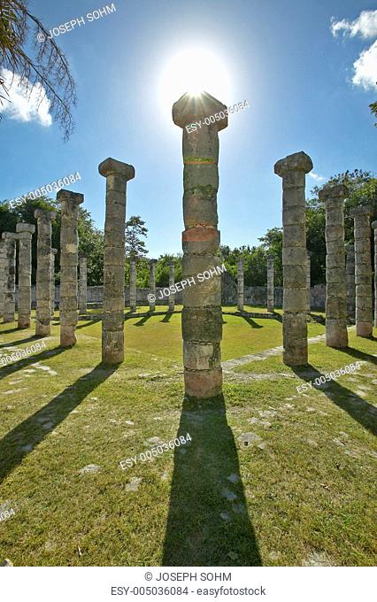 Columns surrounding grassy courtyard for ballgames at Chichen Itza, Mayan Ruins in the Yucatan Peninsula, Mexico