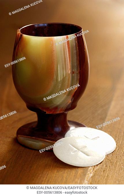 Chalice and communion wafers still life