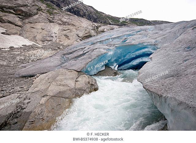 melt water leaking out of glacier snout of Nigardsbreen, a glacier arm of Jostedalsbreen glacier, Norway, Jostedalsbreen National Park