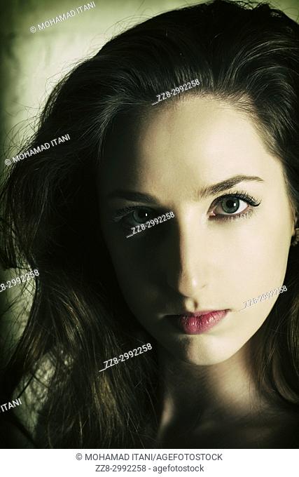 Serious young woman staring