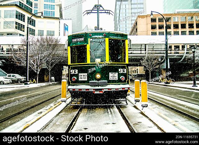 streetcar waiting for passengers in snowstrom in uptown charlotte north carolina